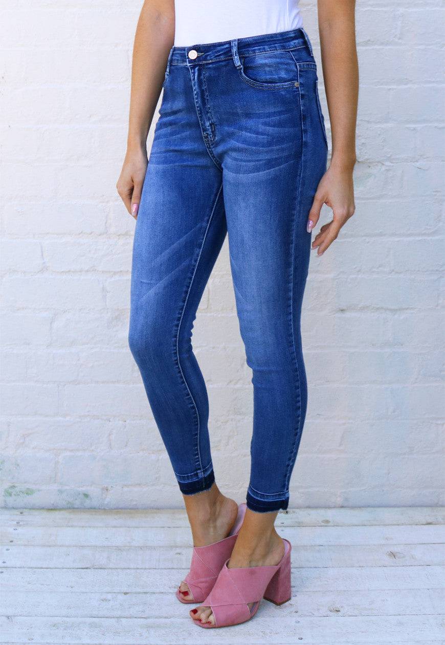 High Waisted Raw Hem Skinny Jeans with Wash Out Detail in Mid Blue - One Nation Clothing