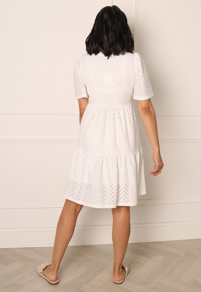 
                  
                    ONLY Broderie Anglaise Short Sleeve Tiered Mini Summer Dress in White - One Nation Clothing
                  
                