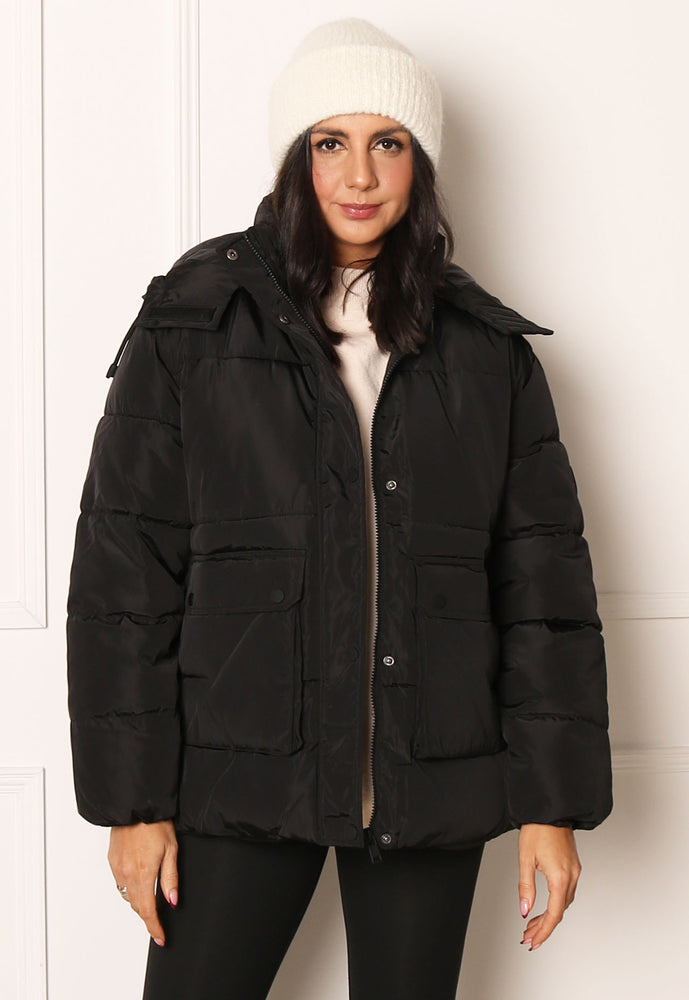 
                  
                    ONLY Nora Luxe Short Oversized Padded Hooded Puffer Coat in Black - One Nation Clothing
                  
                