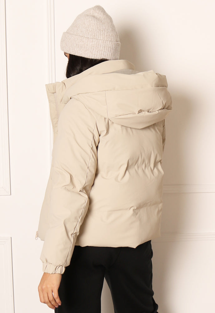 
                  
                    VERO MODA Noe Short Water Repellent Quilted Puffer Jacket with Hood in Beige - One Nation Clothing
                  
                
