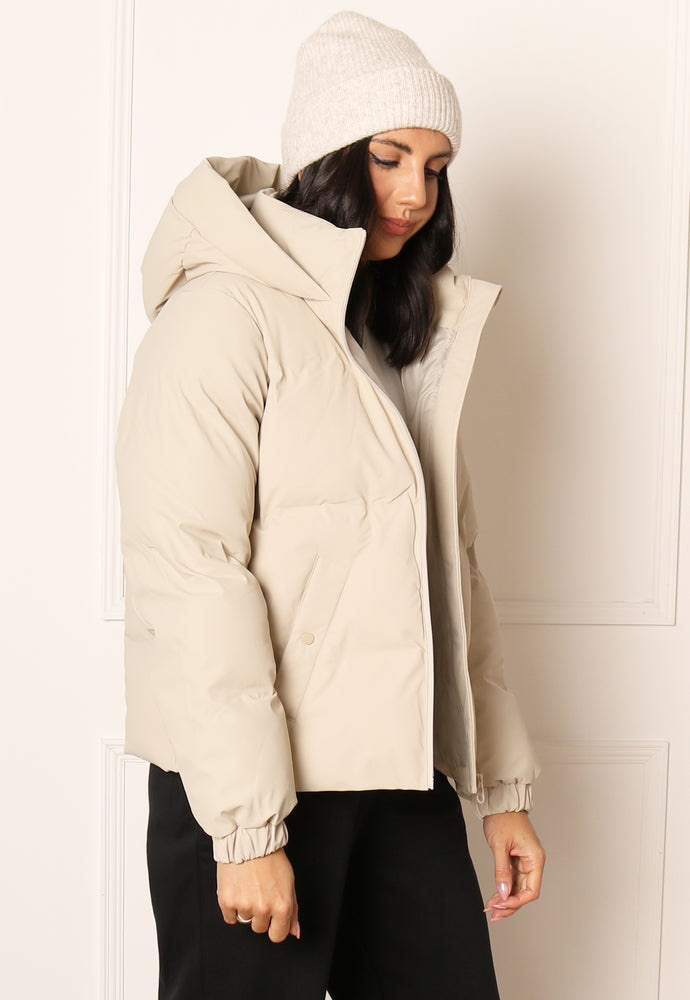 
                  
                    VERO MODA Noe Short Water Repellent Quilted Puffer Jacket with Hood in Beige - One Nation Clothing
                  
                