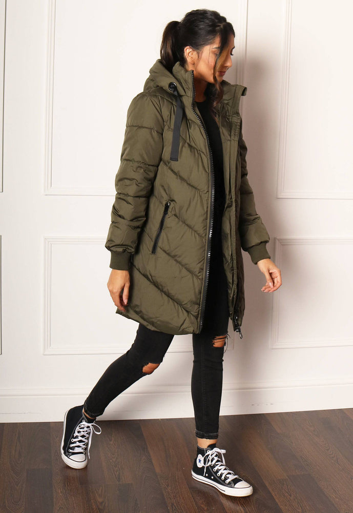 
                  
                    JDY Skylar Chevron Quilted Longline Hooded Puffer Coat in Khaki - One Nation Clothing
                  
                