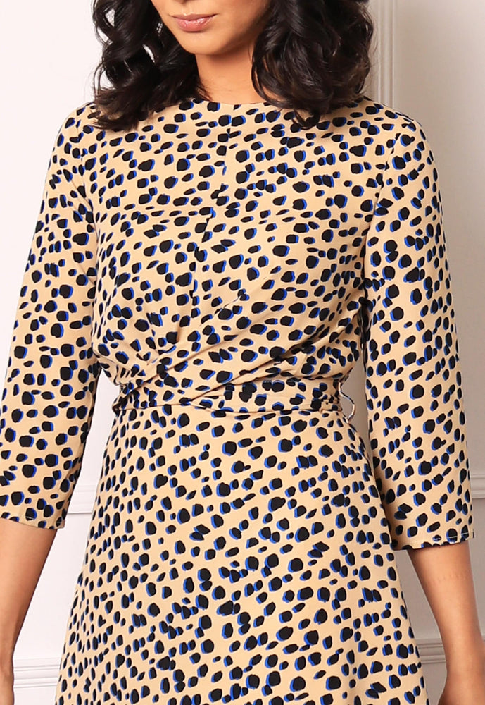 
                  
                    Dalmatian Spot Print Twist Belted Mini Dress with Skater Skirt in Beige, Black & Blue - One Nation Clothing
                  
                