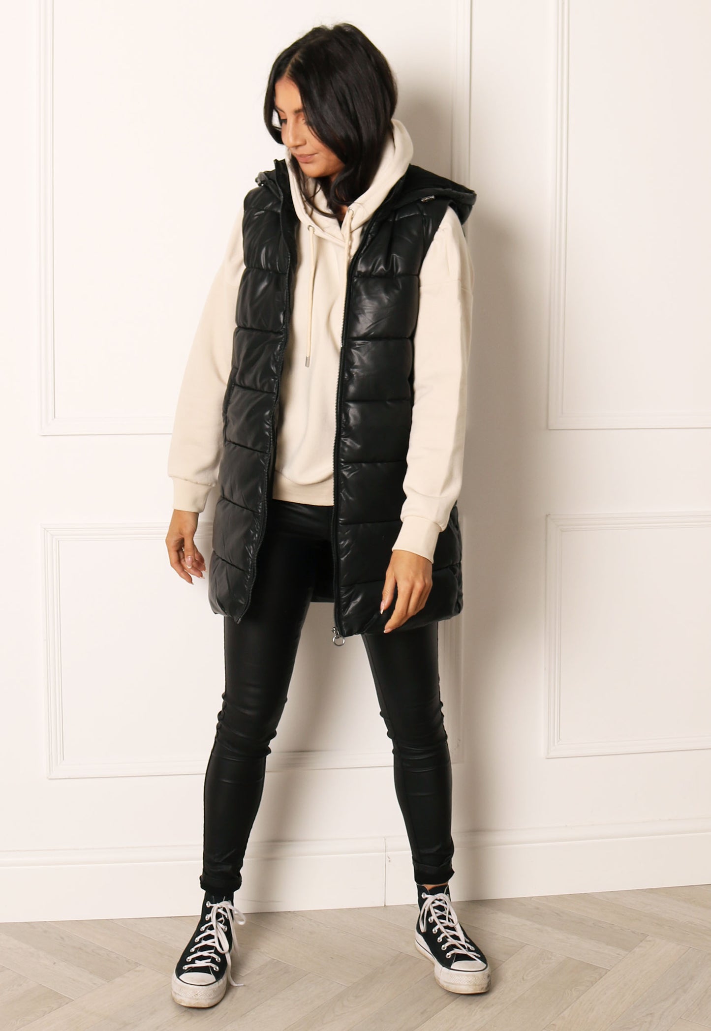 
                  
                    ONLY Anja Faux Leather Sleeveless Puffer Gilet with Hood in Black - One Nation Clothing
                  
                