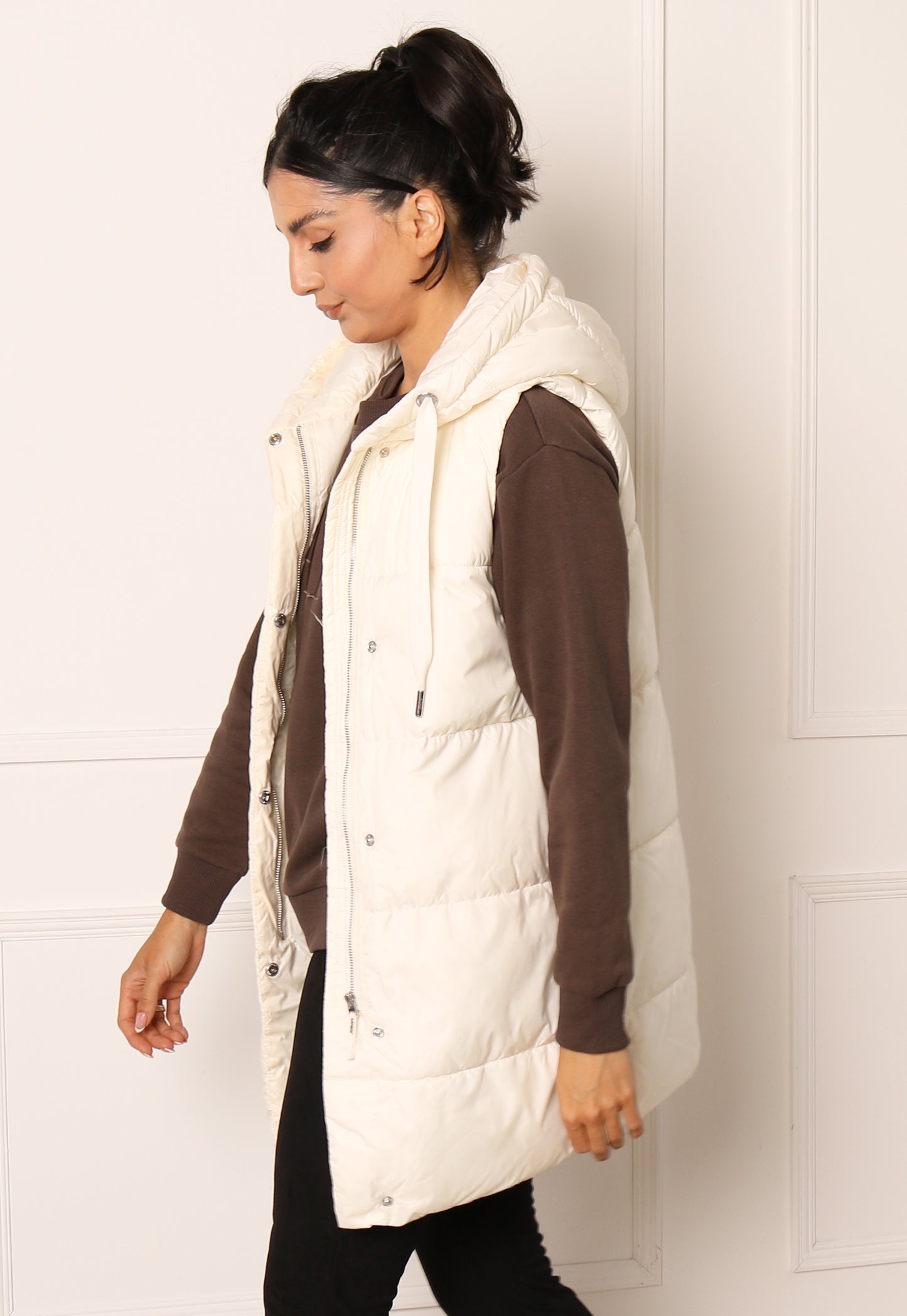 
                  
                    ONLY Asta Longline Sleeveless Puffer Gilet with Hood in Cream - One Nation Clothing
                  
                