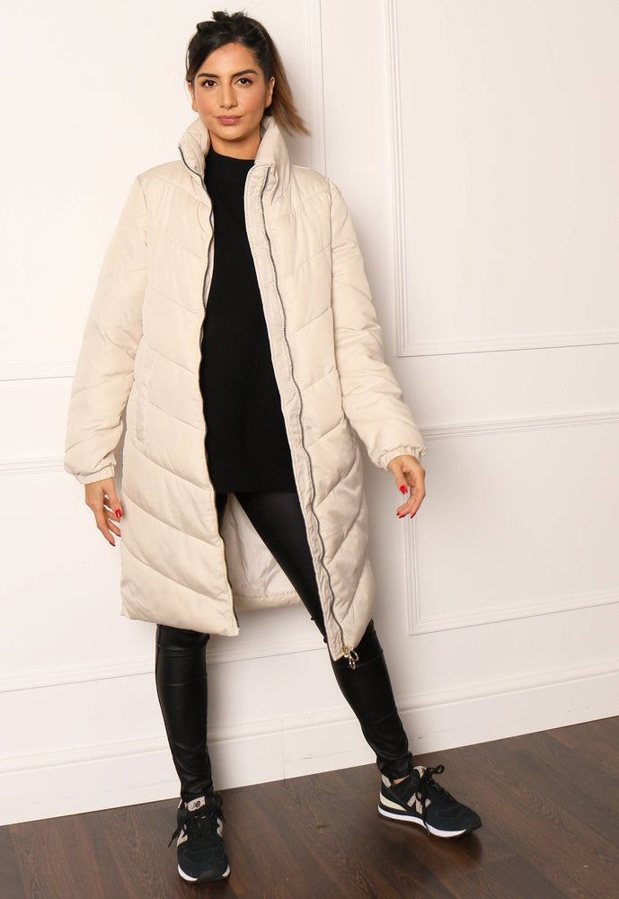 
                  
                    JDY Finno Longline Padded Puffer Coat in Cream - One Nation Clothing
                  
                