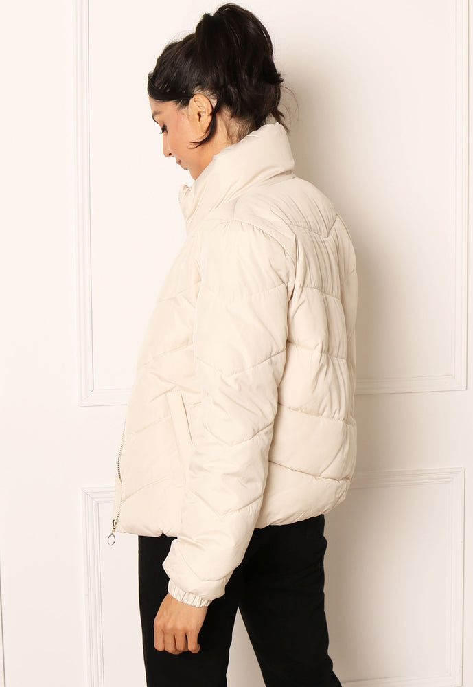 
                  
                    JDY Finno Short Padded Puffer Jacket in Cream - One Nation Clothing
                  
                