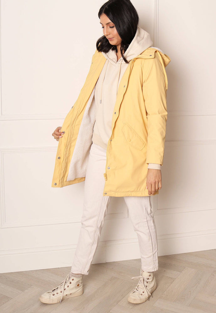 
                  
                    ONLY Sally Rubberised Matte Hooded Raincoat Mac with Shearling Lining in Yellow - One Nation Clothing
                  
                