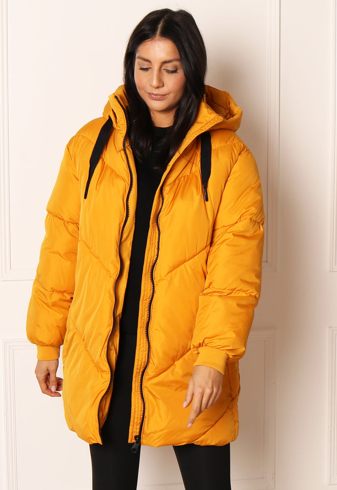 
                  
                    VERO MODA Beverly Oversized Longline Chevron Puffer Coat with Hood in Mustard Yellow - One Nation Clothing
                  
                