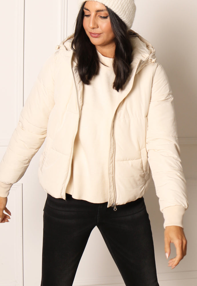 
                  
                    JDY Erica Hooded Boxy Short Padded Puffer Funnel Neck Jacket in Cream - One Nation Clothing
                  
                