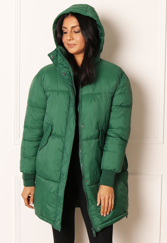 
                  
                    ONLY Petra Oversized Longline Puffer Coat with Foldaway Hood in Green - One Nation Clothing
                  
                