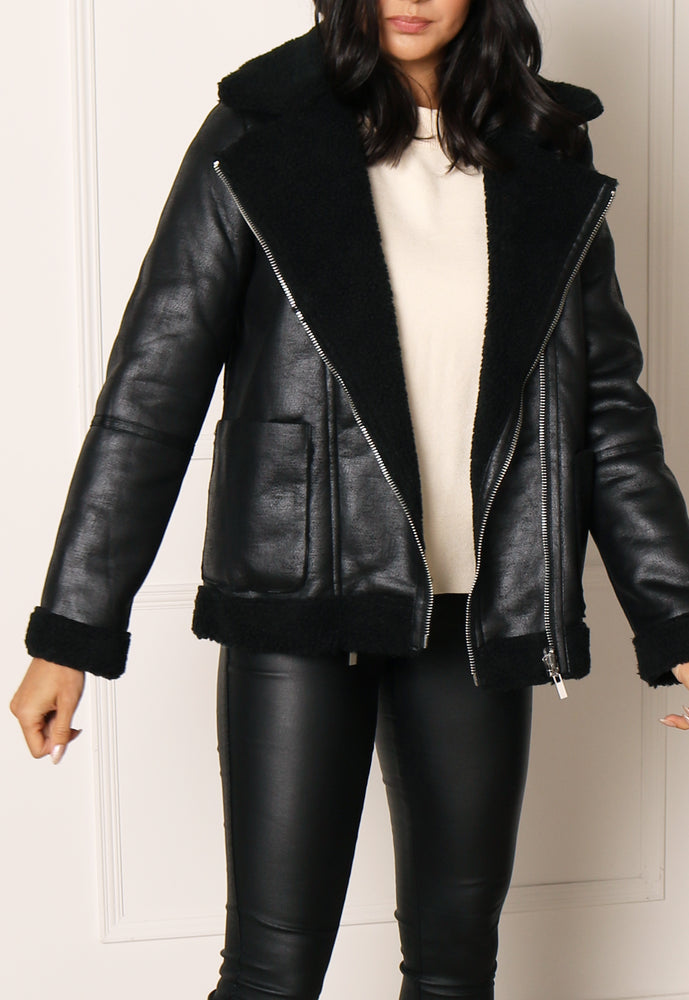 
                  
                    VILA Reversible Faux Leather & Teddy Aviator Coat in Black - One Nation Clothing
                  
                